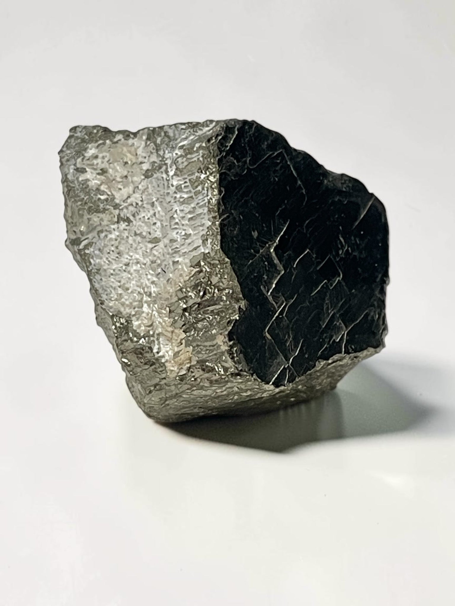 Contrasting reflective face of irregular Climax Mine pyrite specimen