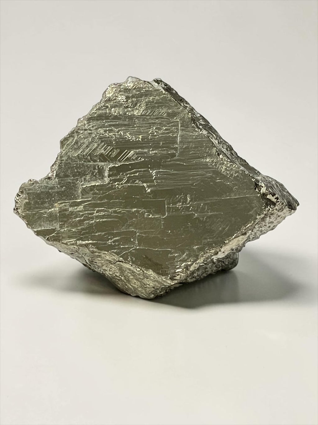 Front view of irregular blocky Climax Mine pyrite specimen with broad metallic striated face