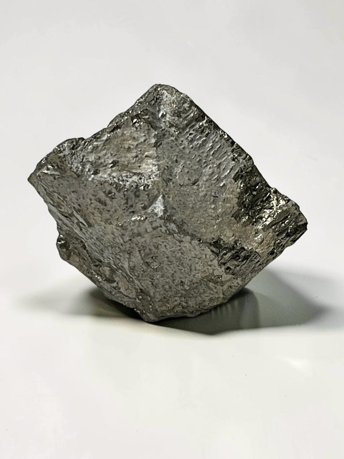 Reverse view of irregular Climax Mine pyrite specimen with rough metallic crystal surfaces