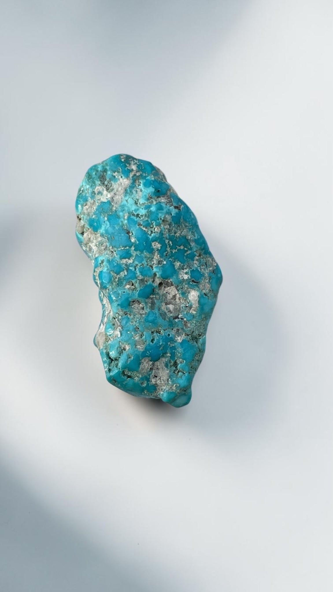 Upright view of 15 gram polished Leadville turquoise specimen with quartz matrix